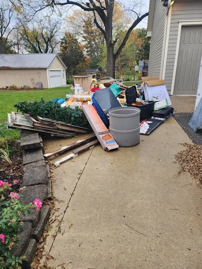Dumpster being loaded with debris for Demolition Dumpster Rental in Lodi